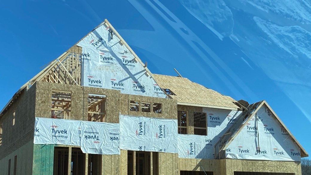 Roof framing under construction in winter; no design load inferred.